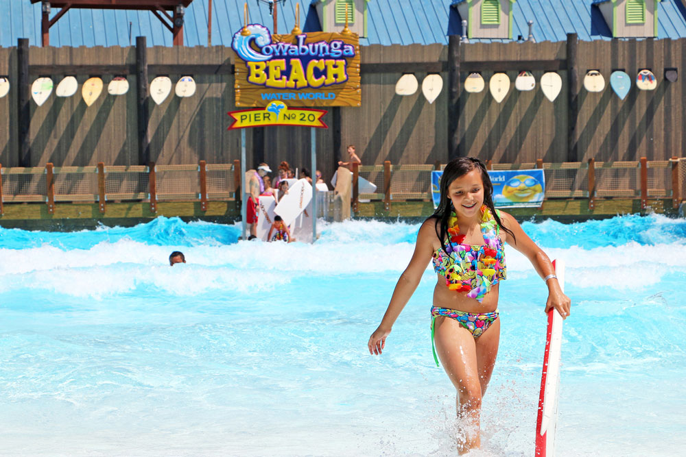 Girl with water board at cowabunga beach, Water World